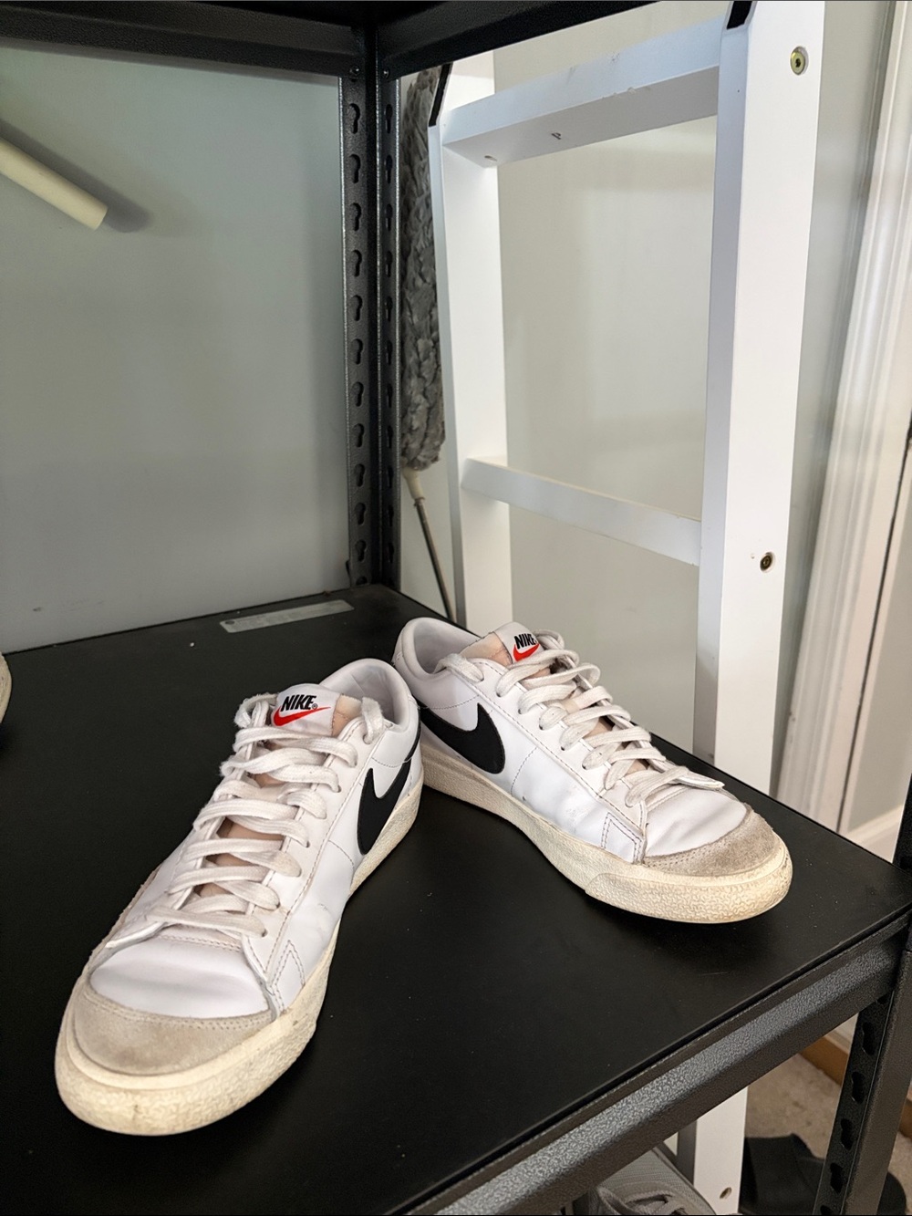 Nike White Sneakers with Black Swoosh and Off-White Soles